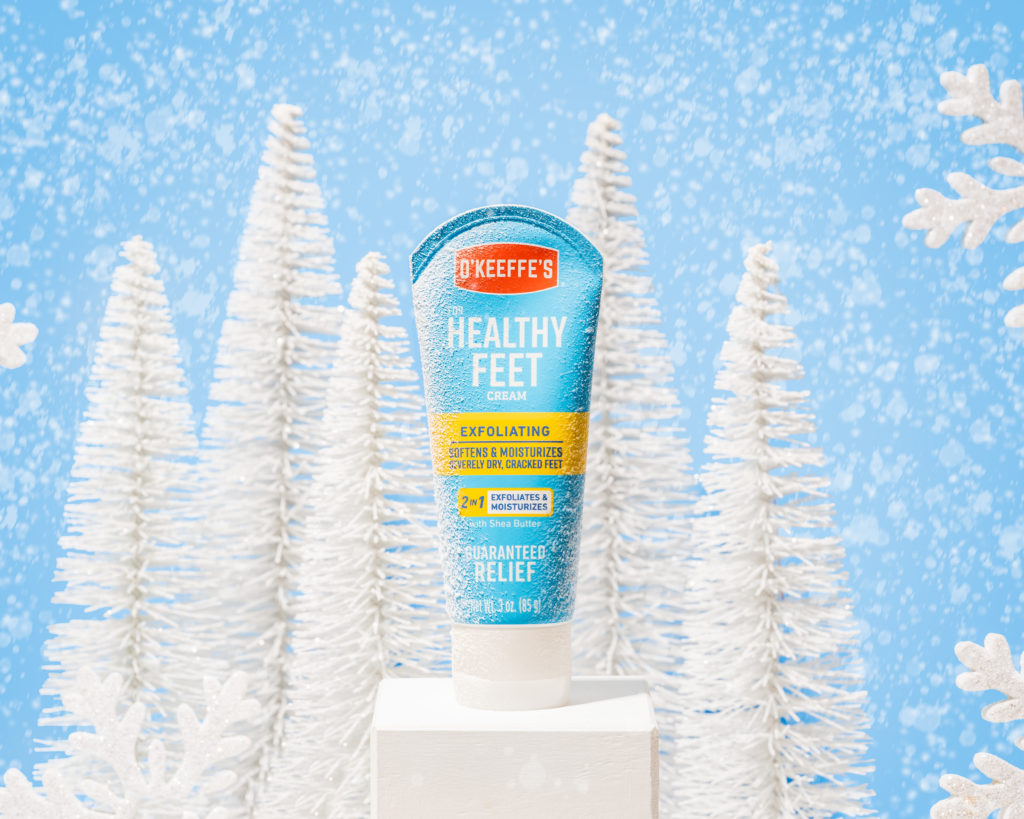 Blue beauty product shot in a snowy white winter scene by professional product photographer Jenna Joann Photos